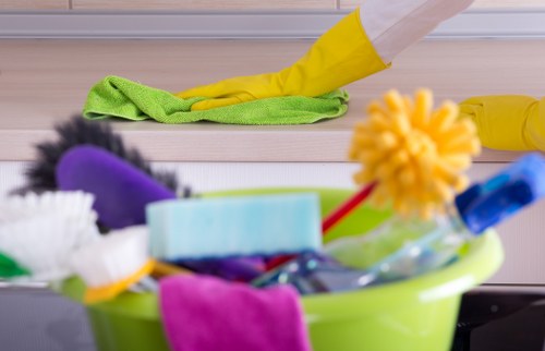 Professional cleaners organizing and disinfecting meeting rooms