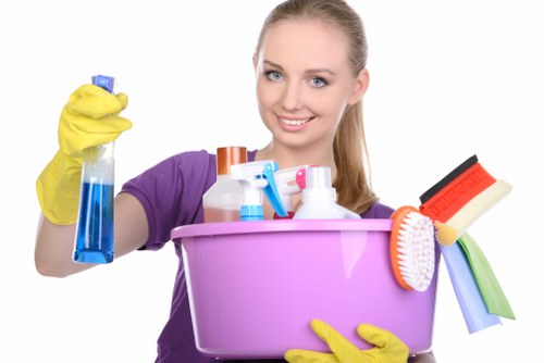 Professional cleaner wiping surfaces in a business space